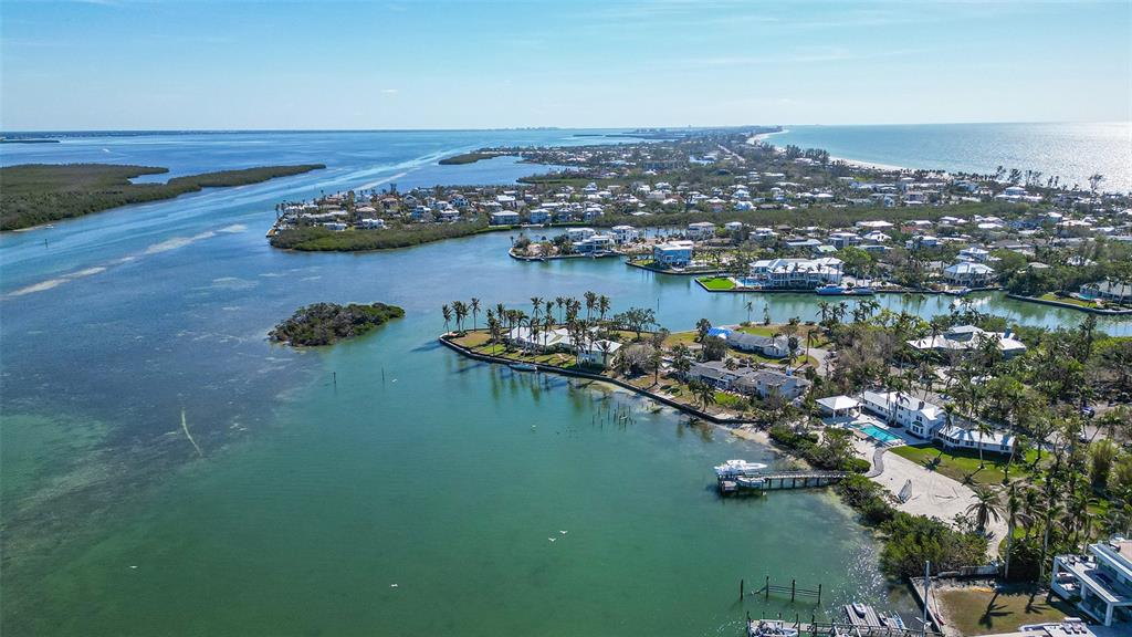 6516 Bayou Hammock Road Longboat Key, FL 34228 - Photo 3 of 20 an aerial view of lake residential houses with outdoor space and seating