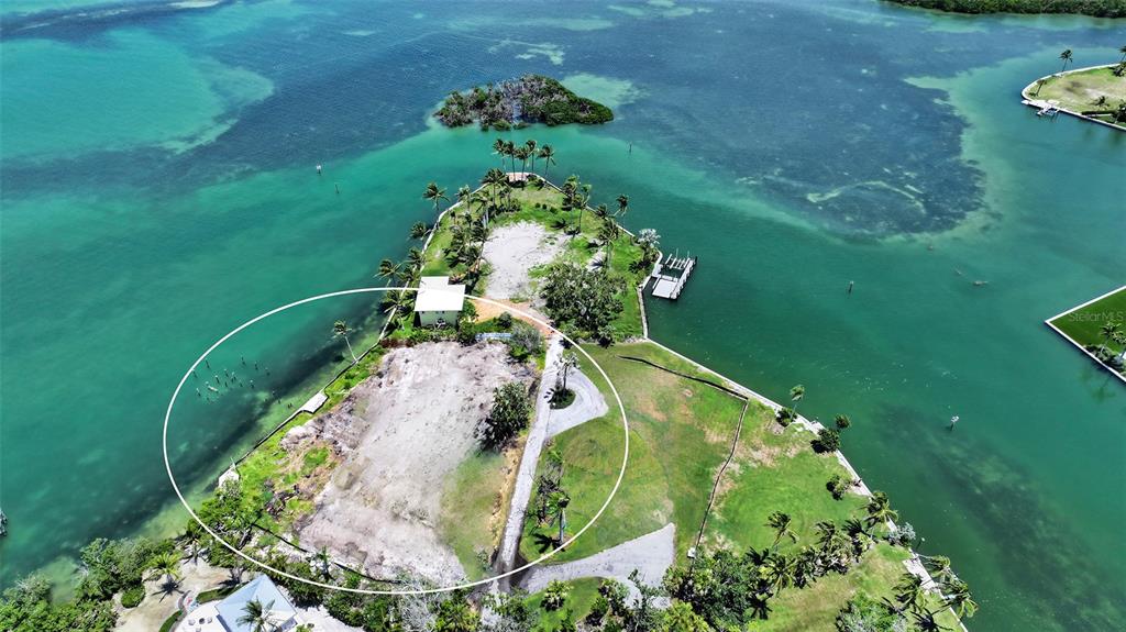 6516 Bayou Hammock Road Longboat Key, FL 34228 - Photo 4 of 20 a bird view of a lake with a yard