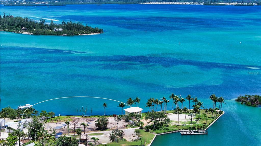 6516 Bayou Hammock Road Longboat Key, FL 34228 - Photo 7 of 20 a front view of a house with a garden