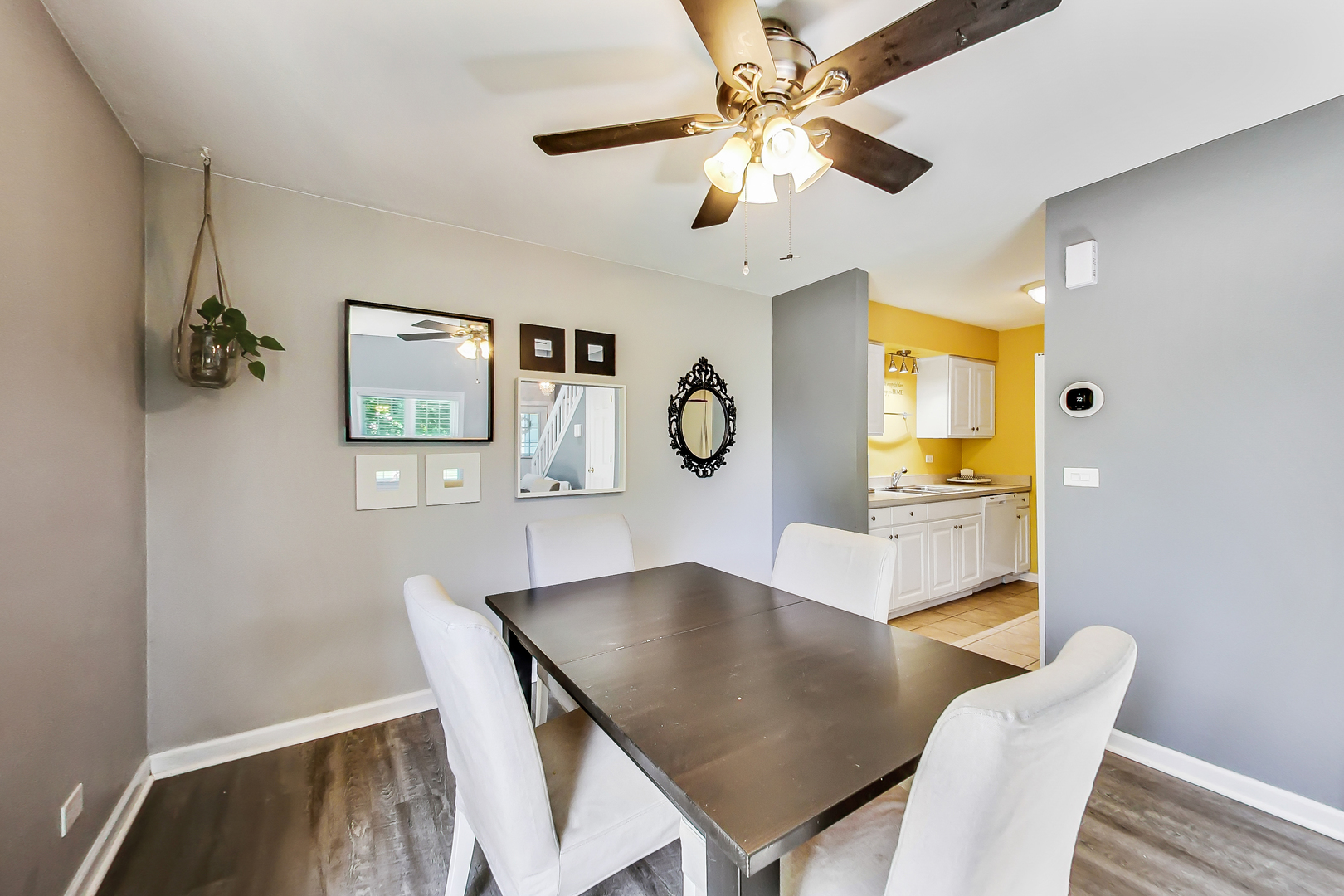 4464 Brookhaven Road Gurnee, IL 60031 - Photo 8 of 36 a view of a dining room with furniture and a chandelier fan