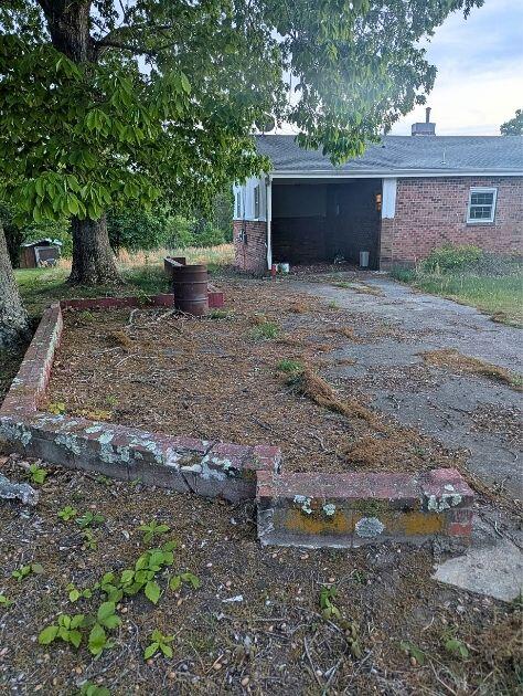 601 Farmers Mountain Road Gretna, VA 24557 - Photo 16 of 20 a view of a backyard with plants and trees