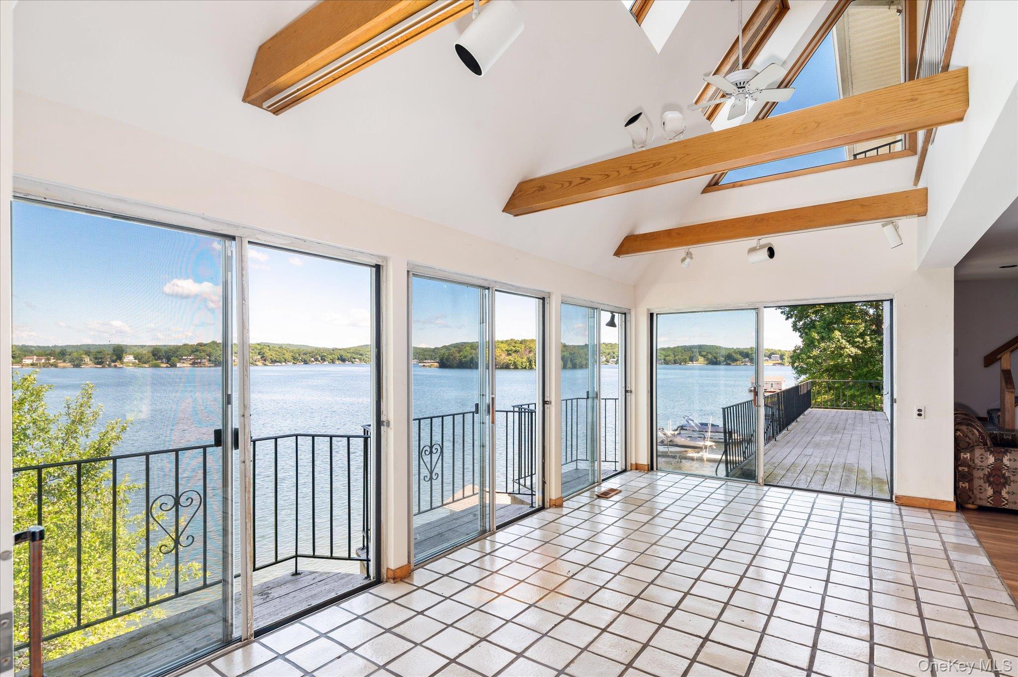 41 Tamarack Road Mahopac, NY 10541 - Photo 13 of 41 Floor-to-ceiling glass frames an unobstructed panorama of open water on Lake Mahopac