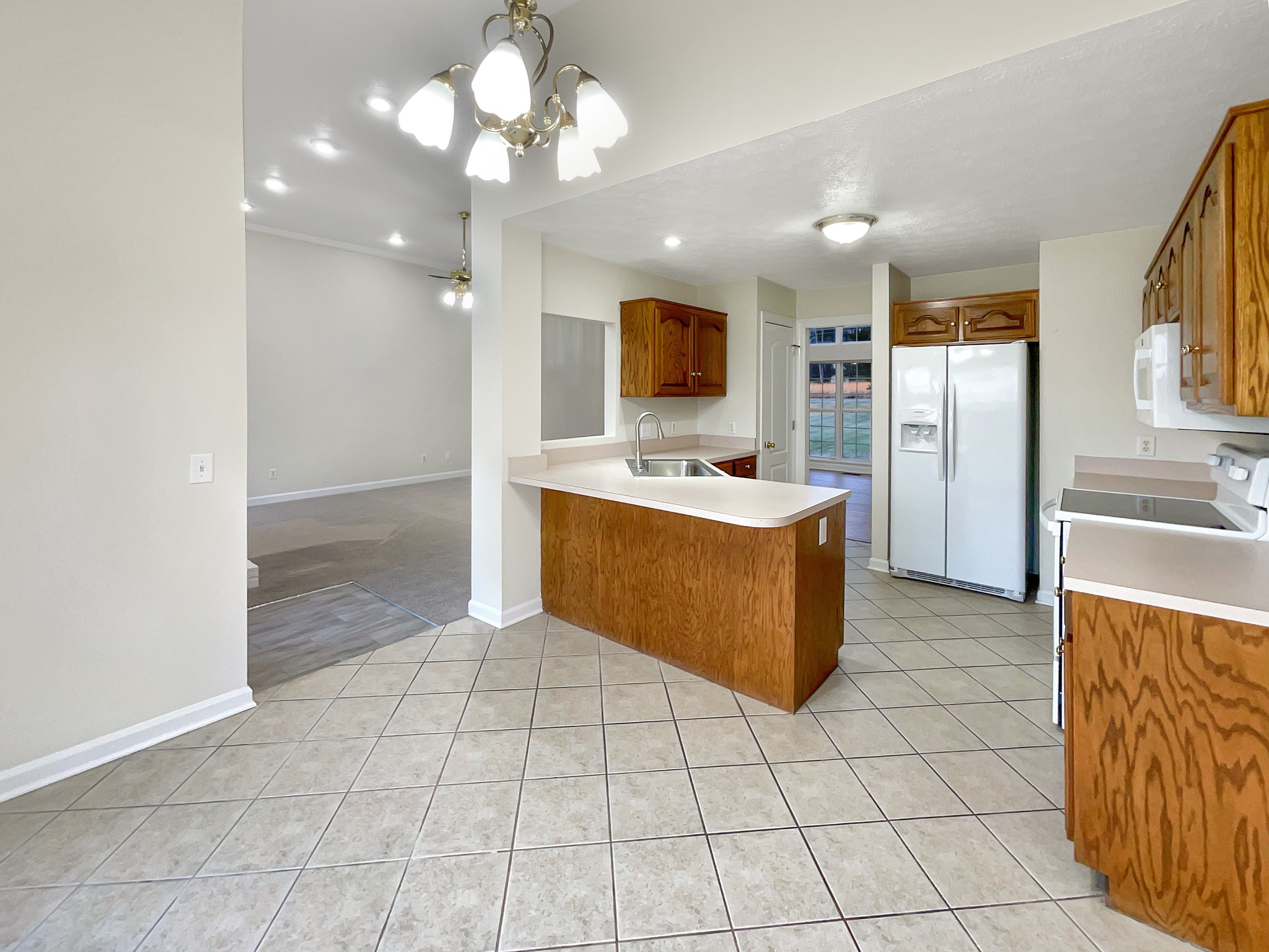 312 Trice Road Lebanon, TN 37087 - Photo 12 of 21 a kitchen with stainless steel appliances a sink and a refrigerator