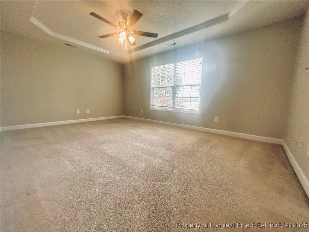 831 Northview Drive Sanford, NC 27332 - Photo 13 of 24 an empty room with a window and a ceiling fan