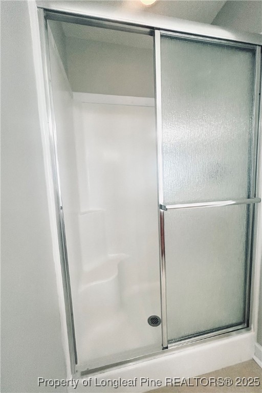 831 Northview Drive Sanford, NC 27332 - Photo 15 of 24 a bathroom with a glass shower door