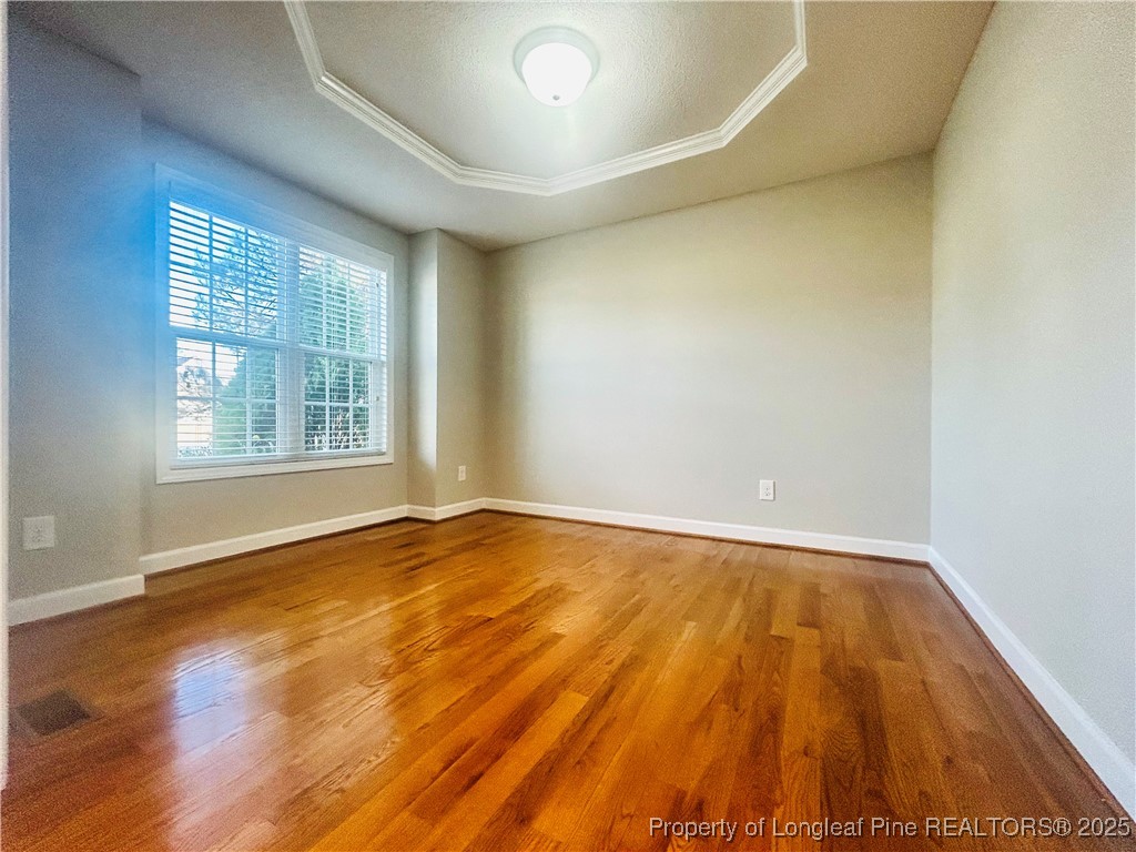 831 Northview Drive Sanford, NC 27332 - Photo 5 of 24 an empty room with wooden floor and windows