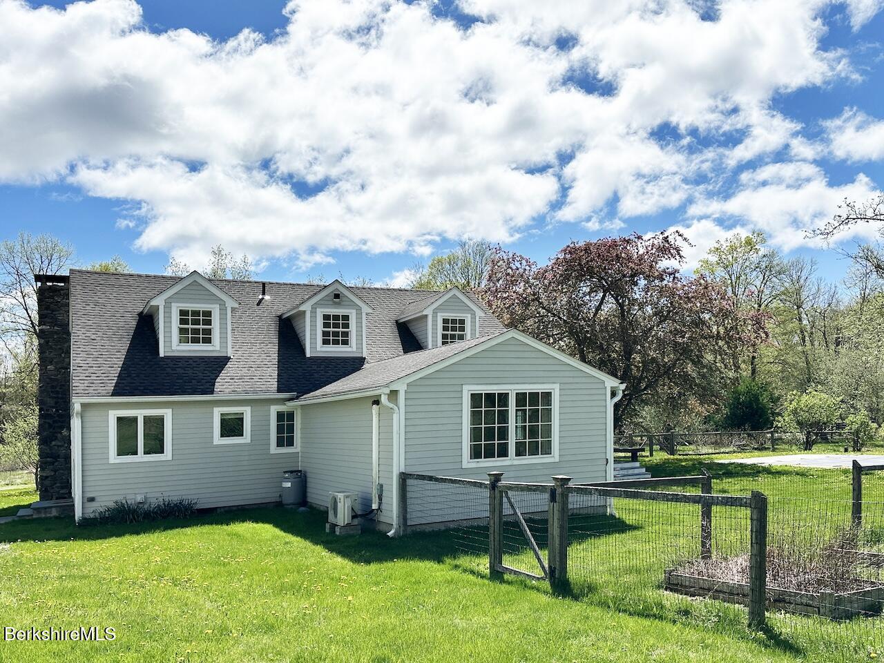 1786 South Undermountain Road Sheffield, MA 01257 - Photo 15 of 17 a front view of a house with a garden