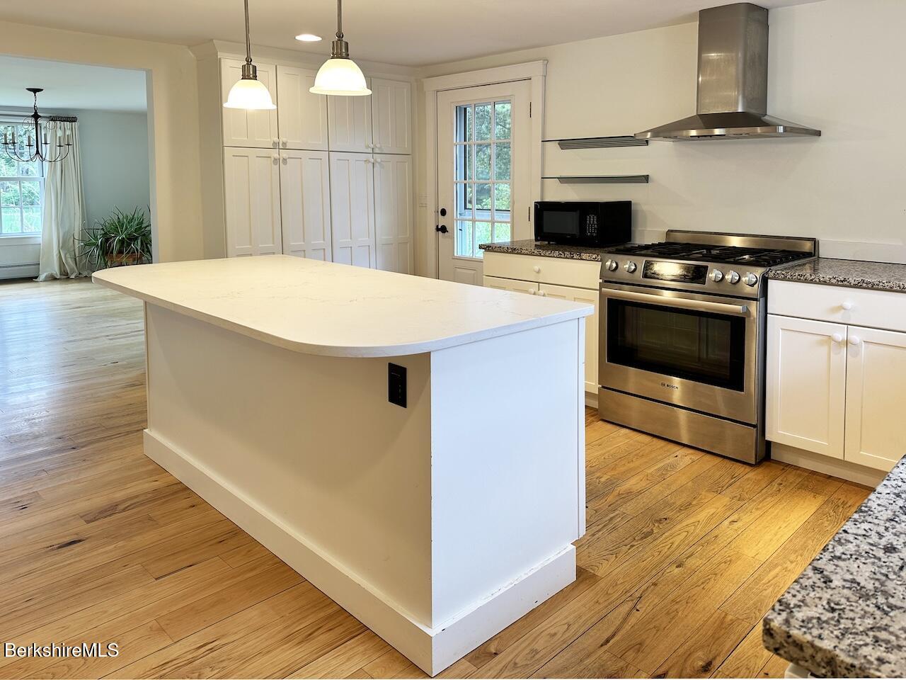1786 South Undermountain Road Sheffield, MA 01257 - Photo 7 of 17 a kitchen with a stove a sink and a refrigerator