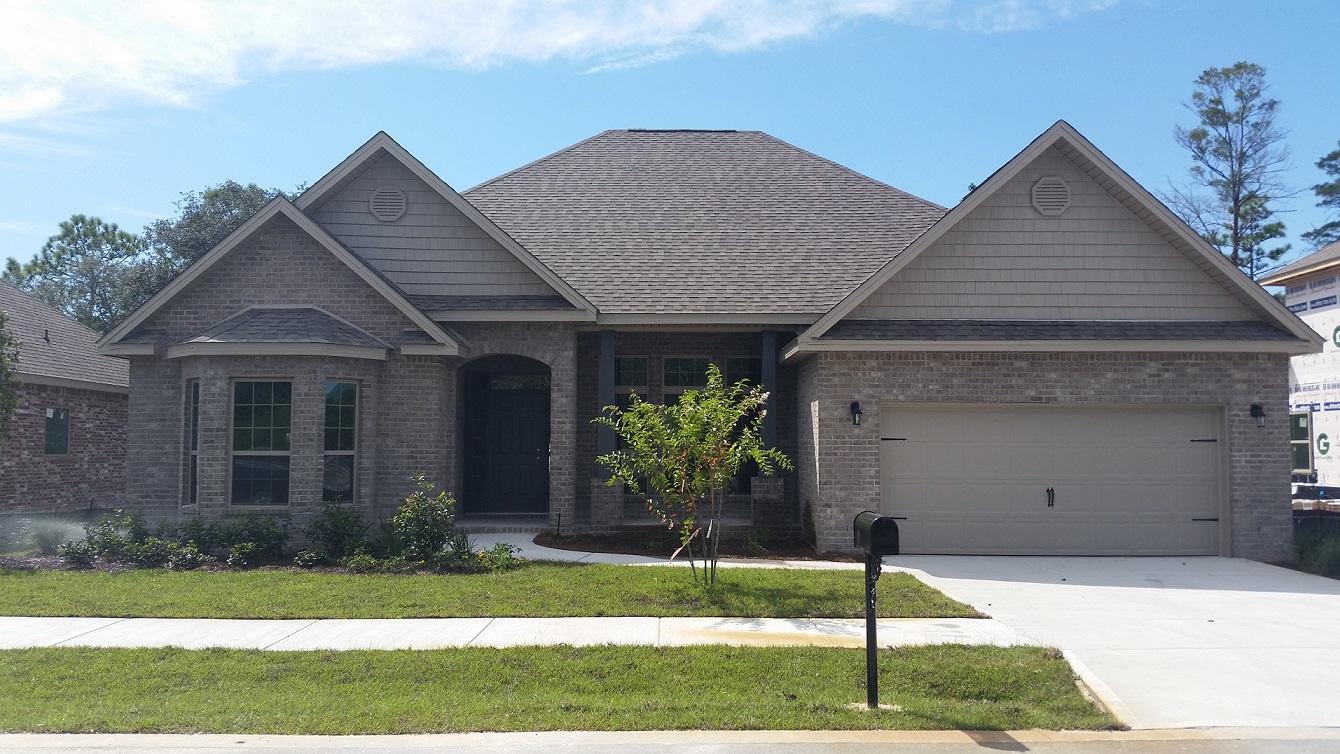 280 Maddox Street Santa Rosa Beach, FL 32459 - Photo 1 of 20 a front view of a house with a garden