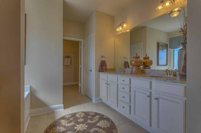280 Maddox Street Santa Rosa Beach, FL 32459 - Photo 11 of 20 a spacious bathroom with a sink a mirror and a shower