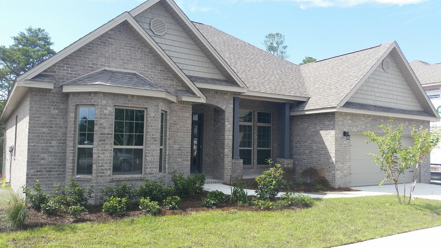 280 Maddox Street Santa Rosa Beach, FL 32459 - Photo 2 of 20 a front view of a house with a yard