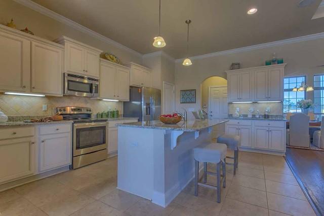 280 Maddox Street Santa Rosa Beach, FL 32459 - Photo 9 of 20 a kitchen with a sink counter top space appliances and cabinets