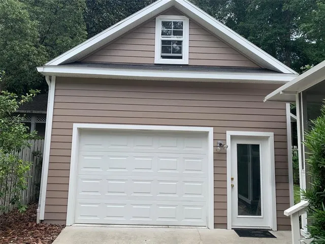 a front view of a house with garage
