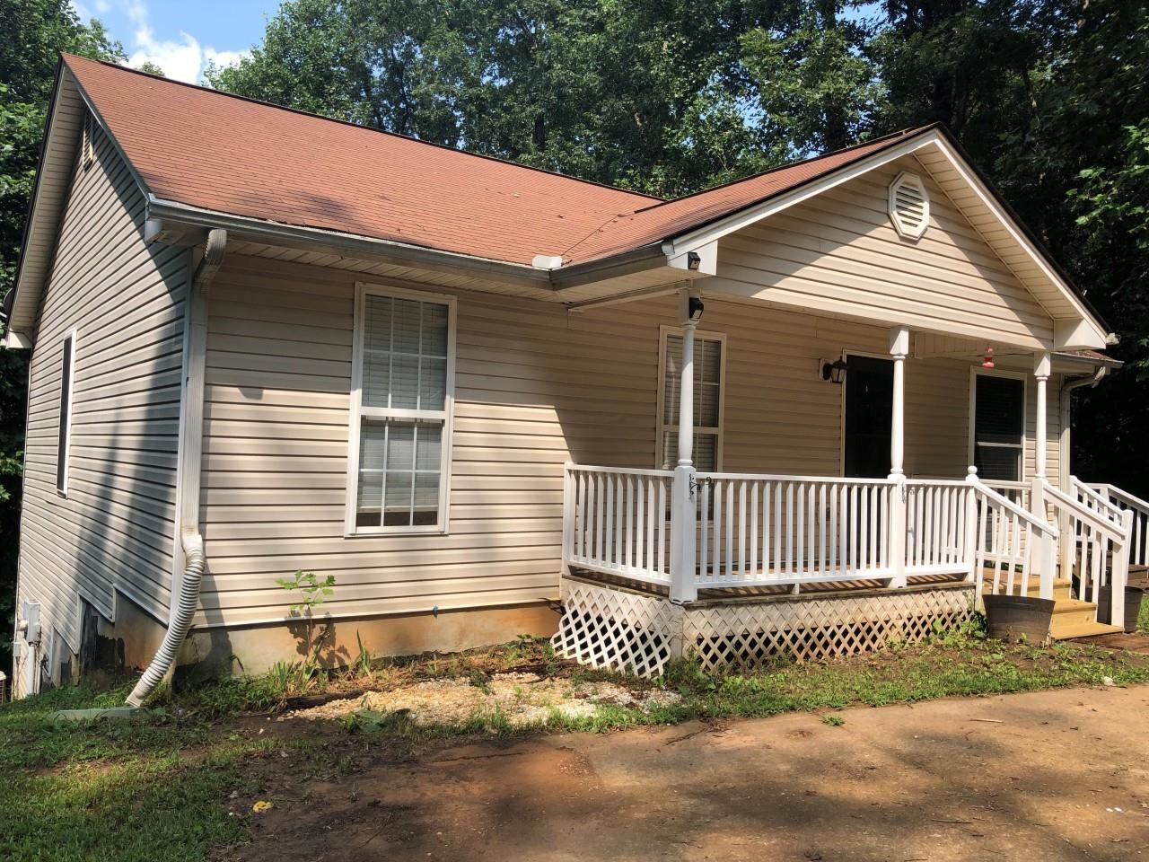 705 Ash Ridge Road Waleska, GA 30183 - Photo 1 of 1 a front view of a house with a garden