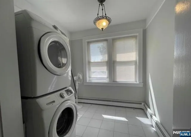 a view of a storage & utility room with washer and dryer