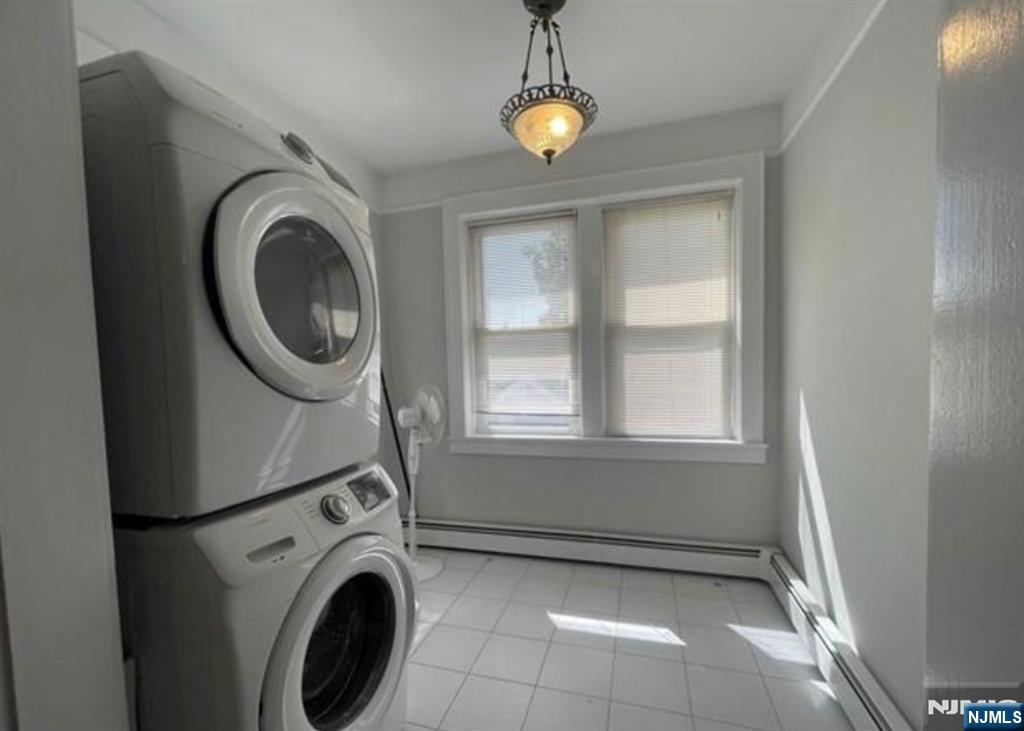 357 MacArthur Avenue, Unit 1 Garfield, NJ 07026 - Photo 11 of 11 a view of a storage & utility room with washer and dryer