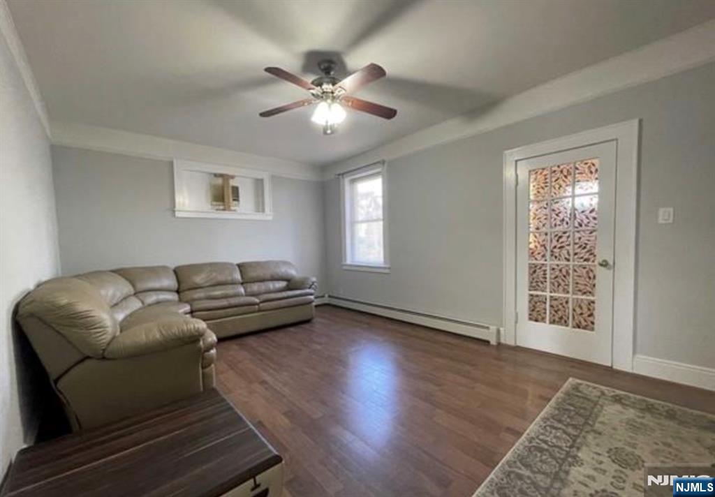 357 MacArthur Avenue, Unit 1 Garfield, NJ 07026 - Photo 8 of 11 a living room with furniture and a window