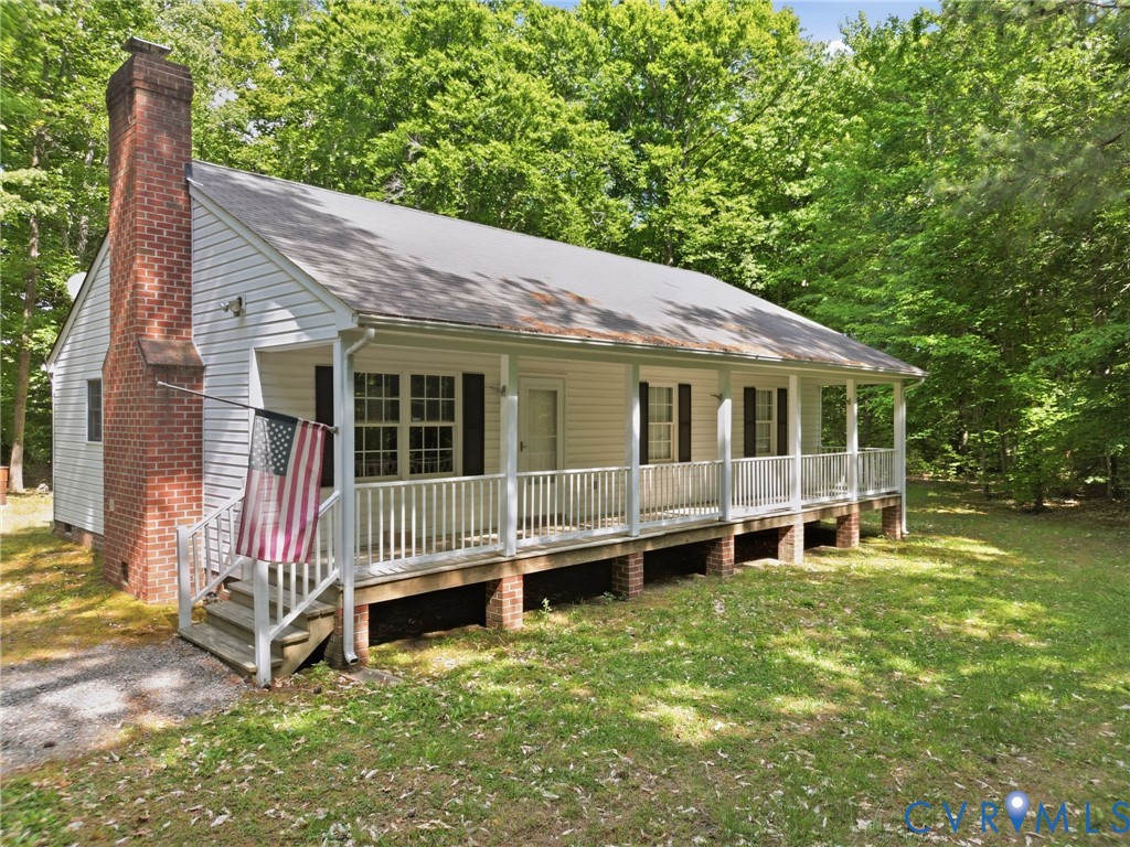 1917 Mahixon Road Manquin, VA 23106 - Photo 1 of 43 a backyard of a house with yard and barbeque oven