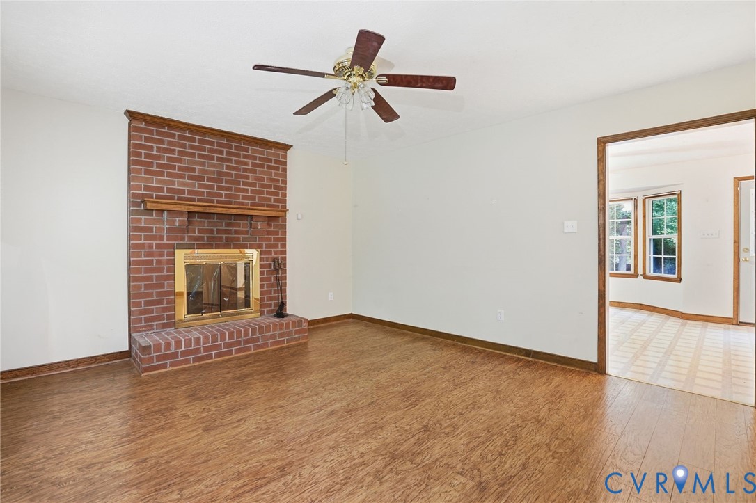1917 Mahixon Road Manquin, VA 23106 - Photo 14 of 43 a view of an empty room with a fireplace and a window