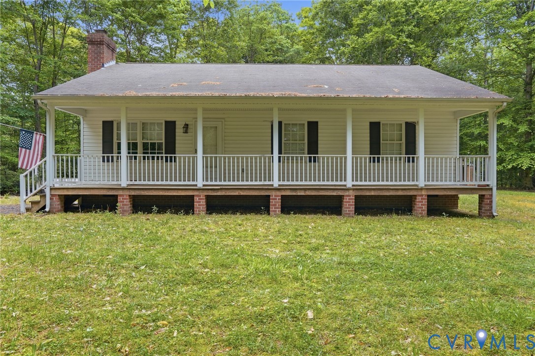 1917 Mahixon Road Manquin, VA 23106 - Photo 2 of 43 a house with trees in the background