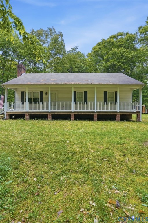 1917 Mahixon Road Manquin, VA 23106 - Photo 3 of 43 a view of a house with a garden and plants
