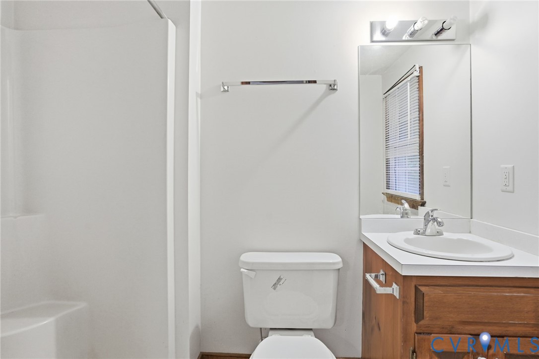 1917 Mahixon Road Manquin, VA 23106 - Photo 34 of 43 a bathroom with a toilet sink and mirror