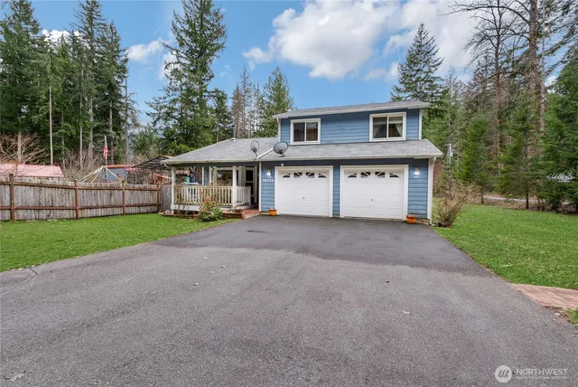 a view of house with yard and green space
