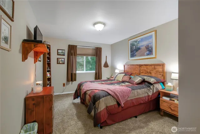 a bedroom with bed and a window