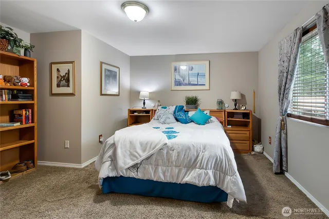 a bedroom with a bed and a cabinets