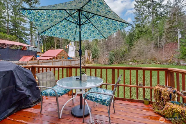 a table and chairs in patio of the house