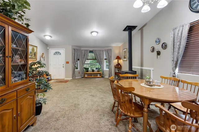 a view of a dining room with furniture and a livingroom