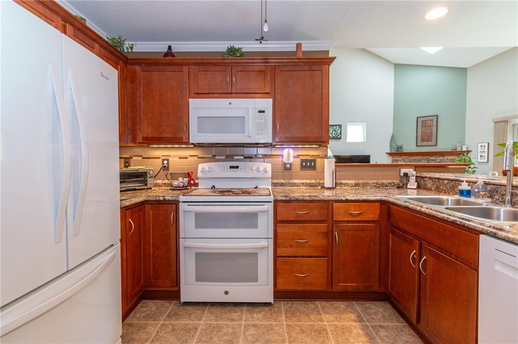 425 Chestnut Lane Apollo, PA 15613 - Photo 12 of 48 a kitchen with a stove sink and cabinets