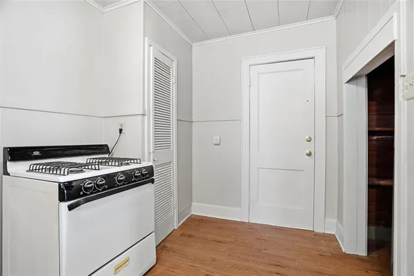 a kitchen with a stove and a microwave
