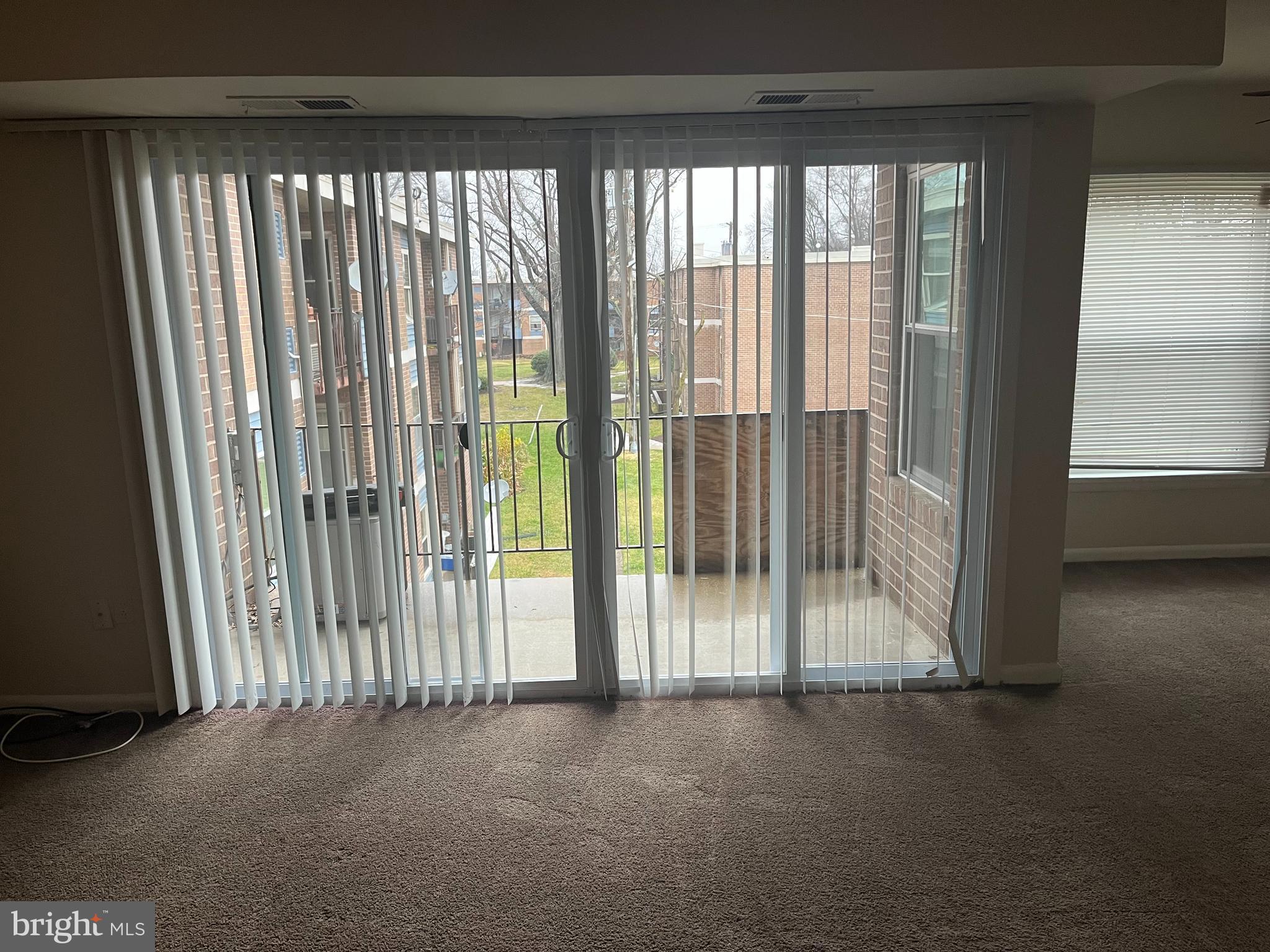 3827 St Barnabas Road, Unit 3831T Suitland, MD 20746 - Photo 5 of 11 a view of a room with floor to ceiling window