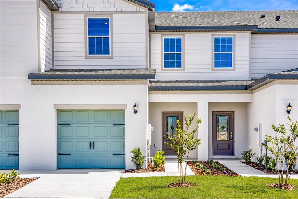 708 Poppy Lane Dundee, FL 33838 - Photo 1 of 16 a view of a entryway front of house
