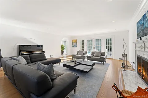 a living room with furniture fireplace and a flat screen tv