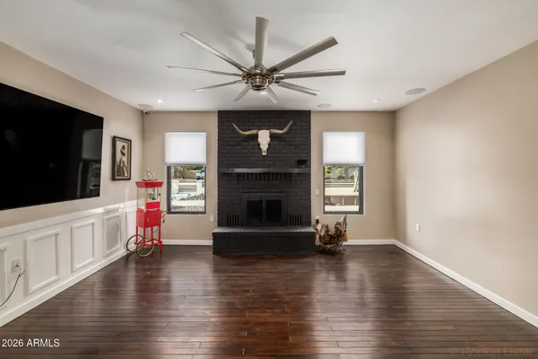 a kitchen with stainless steel appliances kitchen island granite countertop a stove and a sink