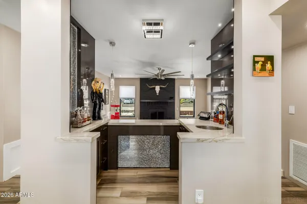 a view of empty room with floor to ceiling window and ceiling fan