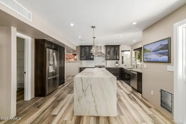 a bathroom with a glass shower door