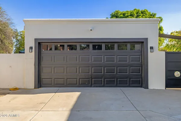 an aerial view of a houses with a swimming pool