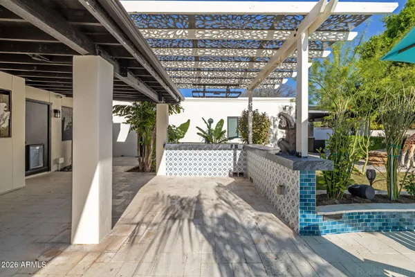 an aerial view of residential house with outdoor space and swimming pool