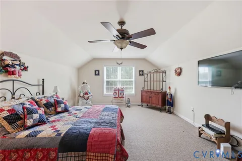 a bedroom with bed and a window