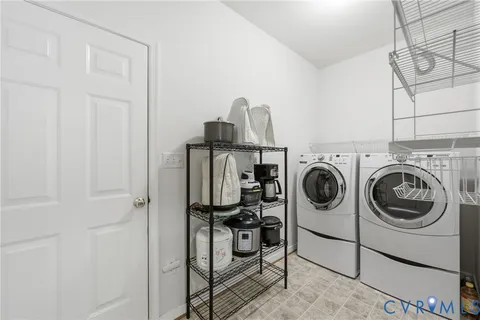 a view of a storage & utility room with washer and dryer