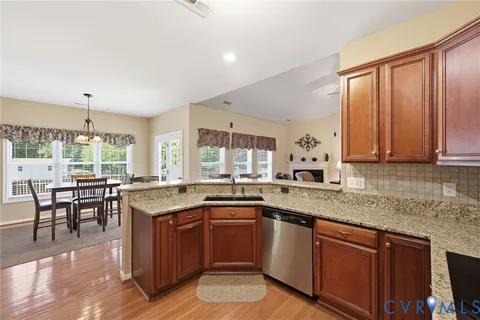 a kitchen with lots of counter top space and dining table