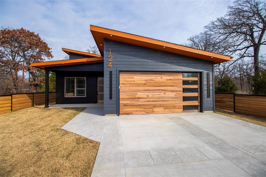 124 Aztec Drive Mabank, TX 75156 - Photo 1 of 33 Modern home featuring driveway, a garage, and a patio area