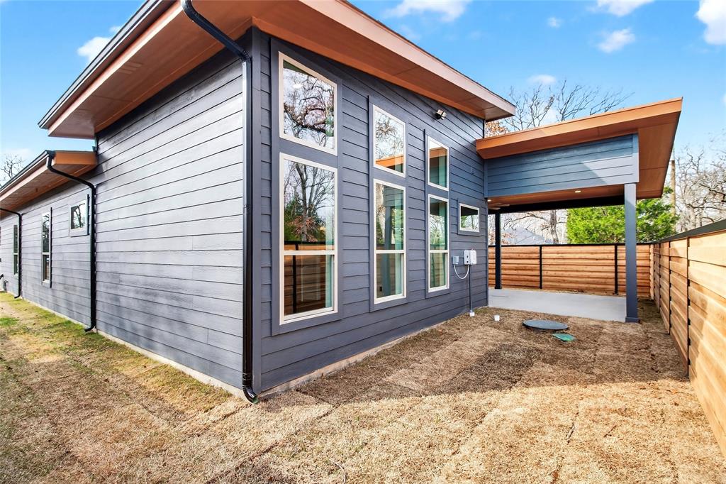 124 Aztec Drive Mabank, TX 75156 - Photo 30 of 33 View of side of property with a fenced backyard and a patio