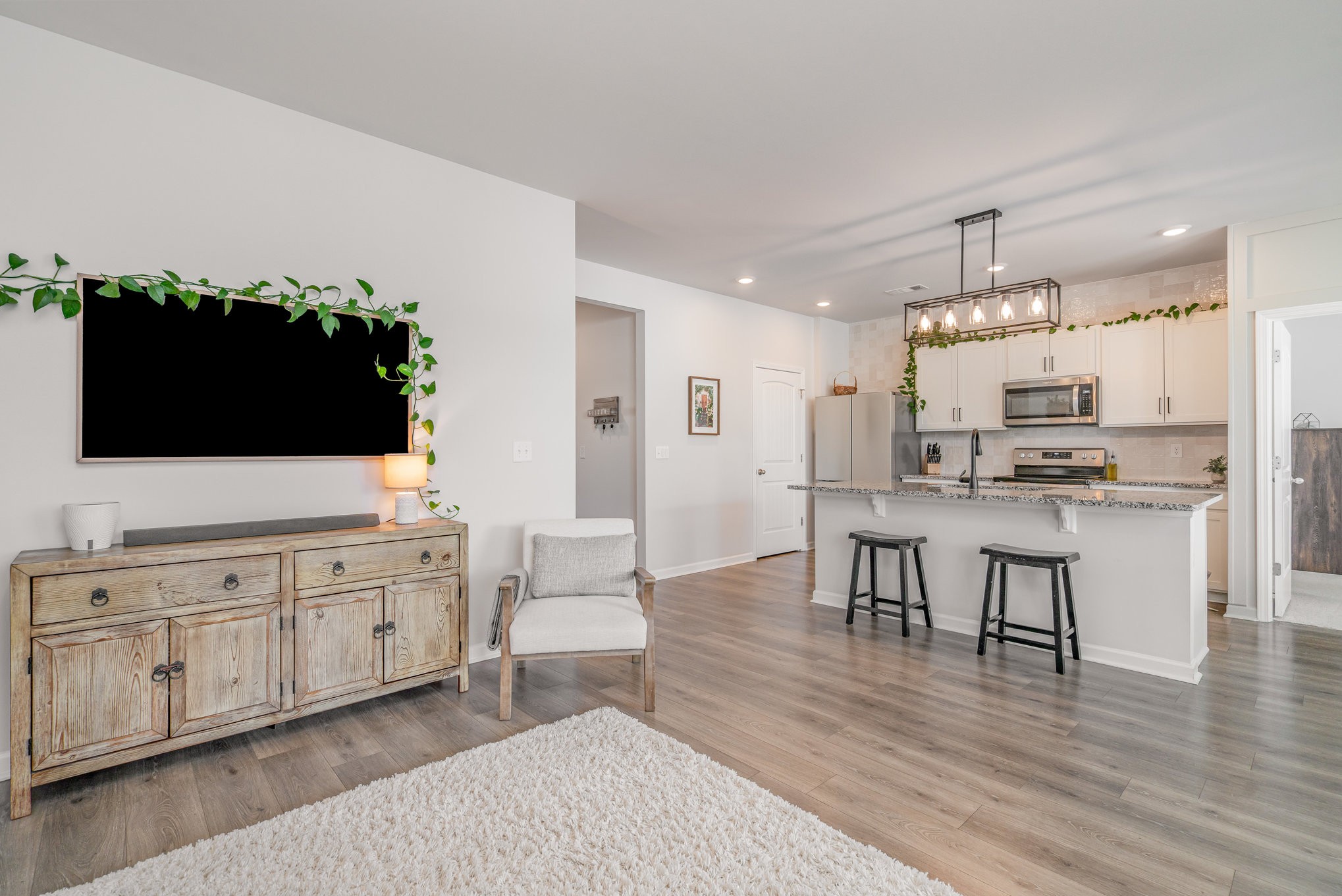 276 Addison Avenue Chapel Hill, TN 37034 - Photo 8 of 27 a kitchen with stainless steel appliances a kitchen island hardwood floor sink stove dining table and chairs