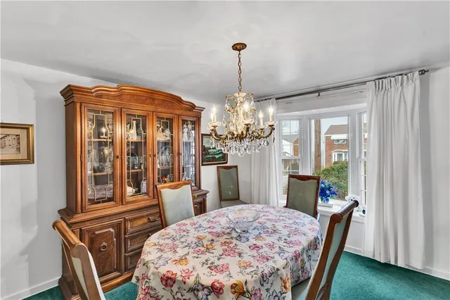 a very nice looking dining room with a chandelier