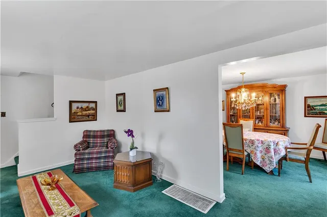 a living room with furniture and a yard