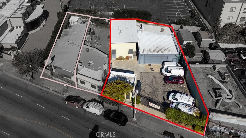 an aerial view of residential house with parking